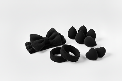 black headbands with bows on them as well as beauty sponges in black 